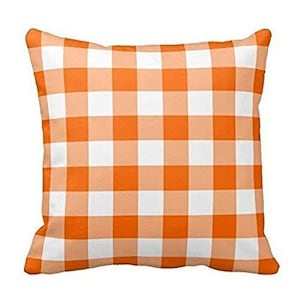 May include: Orange and white checkered throw pillow. The pillow is made of a soft, comfortable fabric and is perfect for adding a touch of farmhouse style to your home.