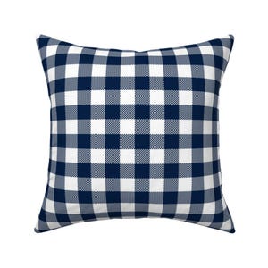 May include: A square pillow with a navy blue and white gingham pattern.