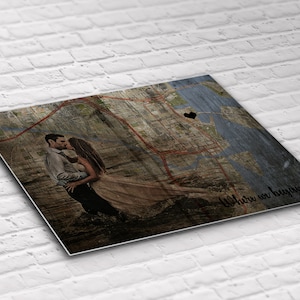 May include: A couple kissing on a vintage map with a black heart marking their location. The text "Where we began..." is written on the bottom right corner of the map.