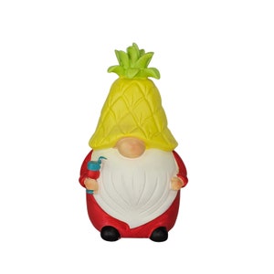 May include: A red and white gnome figurine wearing a yellow pineapple hat. The gnome is holding a blue and red object in its hand.