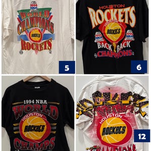 May include: Four different t-shirts featuring the Houston Rockets logo and the text "World Champions". The shirts are black and white with red, yellow, and blue accents. The shirts are all from the 1994 and 1995 NBA seasons.