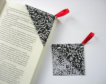 Set of 2 bookmarks with handy loop, paperback corners, paper triangle.