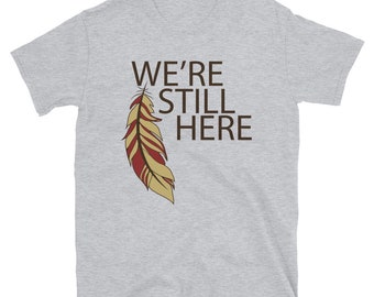 We're Still Here Feather Unisex T-shirts, Indigenous Pride, American Indian, Brown Text, Maroon, Beige