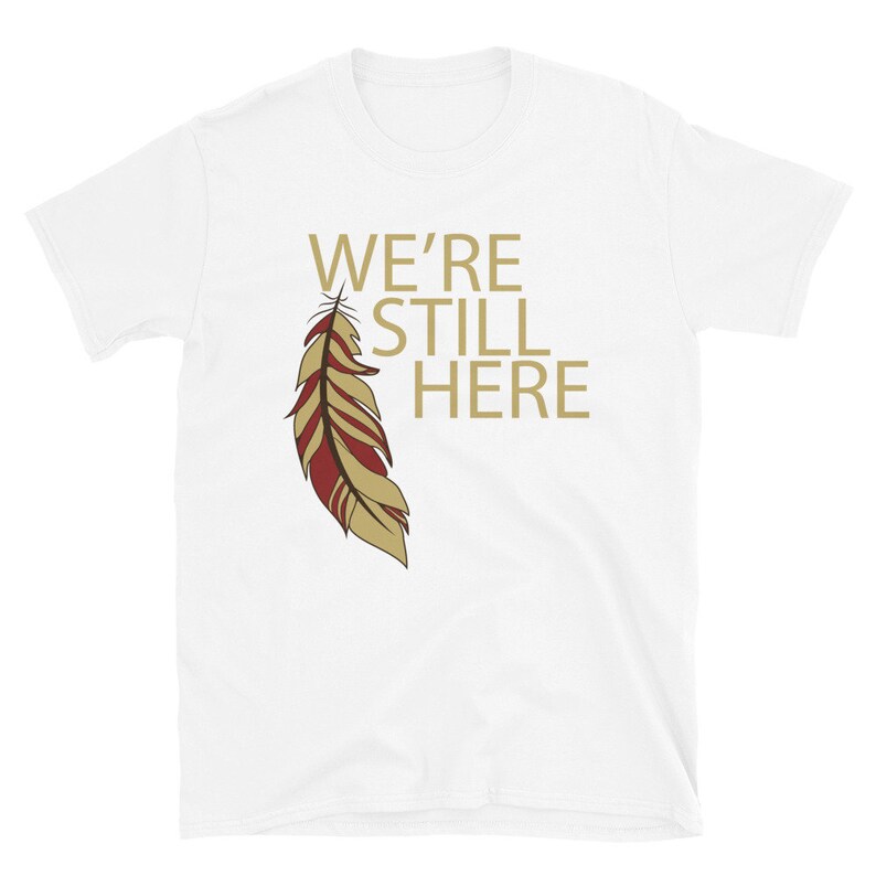We're Still Here Feather Unisex T-shirts, Indigenous Pride, American Indian, Beige Text, Maroon, Brown White