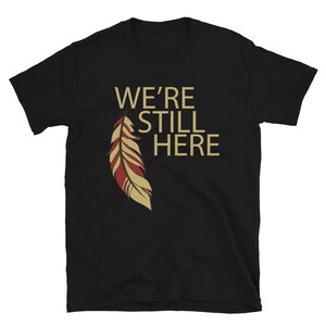 We're Still Here Feather Unisex T-shirts, Indigenous Pride, American Indian, Beige Text, Maroon, Brown Black