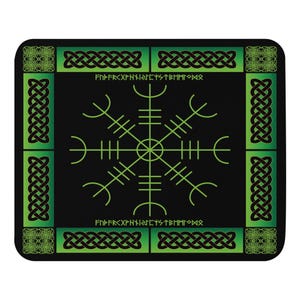 May include: Black square mousepad featuring a green Helm of Awe symbol, a Viking symbol for protection, in the center. The border has green Celtic knot patterns and the text "FNPFRXPNYIRIEIYSTBMMIOMR".