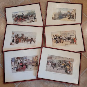 May include: Six framed antique prints of horse-drawn carriages in a variety of settings. The prints are in black and white and feature detailed illustrations of the carriages, horses, and people.
