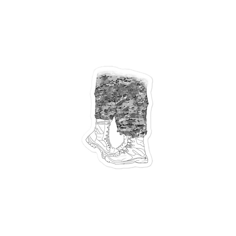 May include: A pair of black and white camouflage pants with white combat boots.