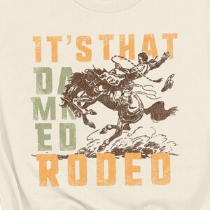 It’s That Damned Rodeo Shirt | Western Graphic Tee | Rustic Rodeo Cowboy Shirt | Vintage Bronc Rider Tee | Country Western Apparel