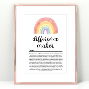 May include: A framed print with a rose gold border features a watercolor rainbow above the words "difference maker." The definition of "difference maker" is printed below the title, describing the role of a teacher.