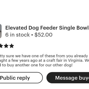 May include: A black elevated dog feeder featuring a single stainless steel bowl. The front panel of the wooden stand is printed with the white text "PAWS OFF" above the text "CHOW TIME" and includes a small white paw print graphic design.
