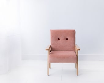 Simple wooden armchair for childrens room, light salmon pink velvet