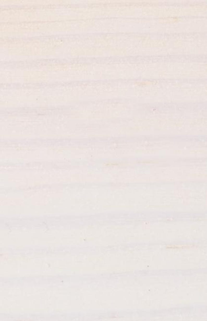 May include: A close-up view of a light-colored wooden surface featuring a distinct grain pattern. The wood displays horizontal lines and a pale, off-white to cream coloration with subtle variations in texture across the entire visible area.