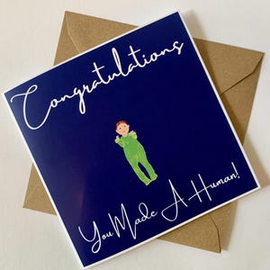 Vieringskaart voor aankomst baby met de slogan 'Congratulations You Made a Human!'
