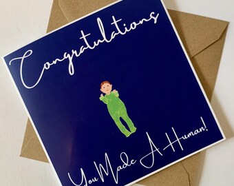 Carte de célébration de l'arrivée de bébé avec le slogan « Félicitations, vous êtes devenu un être humain !