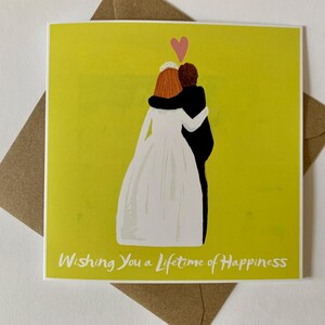 Cartão de casamento com um casal vestindo roupas de casamento e o slogan "Desejando a você uma vida inteira de felicidade"
