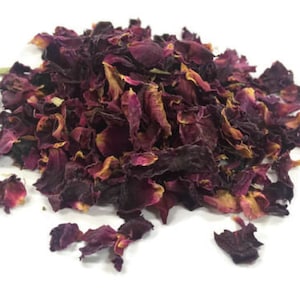 May include: A pile of dried rose petals, a natural ingredient for crafting and aromatherapy. The petals are a mix of deep red and pink hues.