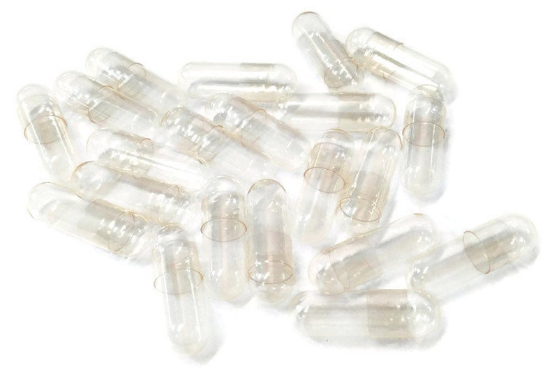 Puede incluir: Un mont&oacute;n de c&aacute;psulas de gelatina vac&iacute;as y transparentes, com&uacute;nmente utilizadas para suplementos diet&eacute;ticos o medicamentos.