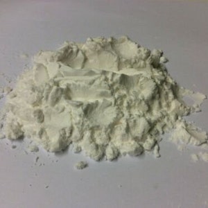 May include: A close-up of a pile of white powder, likely cornstarch or flour.