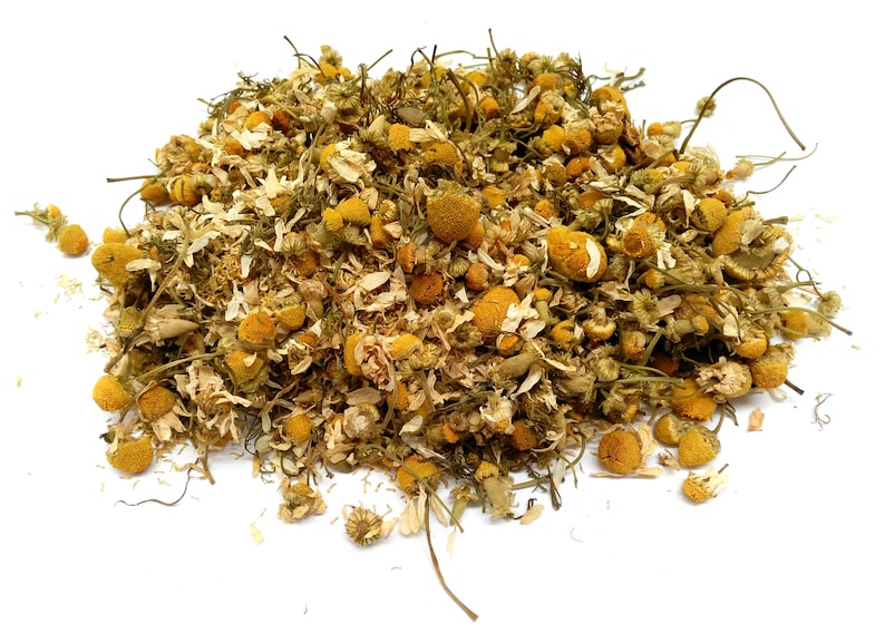 May include: Dried chamomile flowers, a blend of white petals and yellow centers, for making tea or herbal remedies.