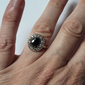 Ring with central sapphire
