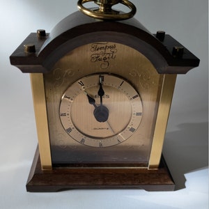 Vintage clock in wood and steel. Emes Tempus fugit