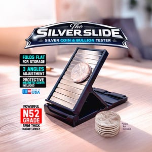 May include: The Silver Slide silver coin and bullion tester. The black and silver device has a coin resting on the testing surface. The device folds flat for storage and has 3 angles of adjustment. The device includes a protective magnetic cover and is made in the USA.