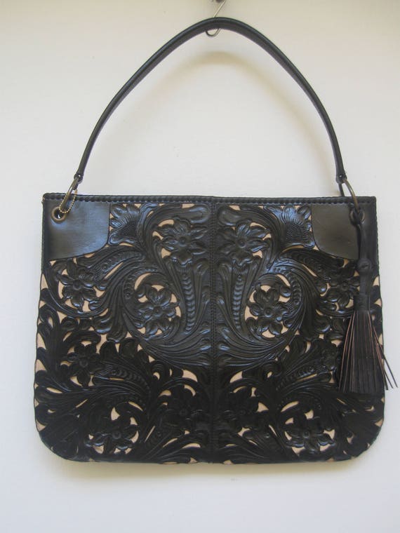 black tooled leather bag