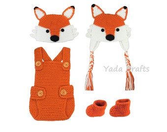 May include: Orange crochet baby outfit with a fox hat, booties, and a Yada Crafts logo.