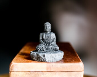 Shungite statue small meditating buddha on shungite stand
