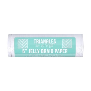 May include: A roll of white paper with a teal label. The label reads "TRIANGLES on a Roll" and "5" JELLY BRAID PAPER". The paper is 5 inches wide and designed for braid rows.