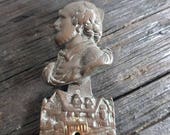 Antique bronze door knocker in form of a figure in good condition circa early 1930s