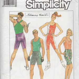 May include: Simplicity sewing pattern number 8562 for a cycling outfit. The pattern includes instructions for an overlock/serger or conventional machine. The pattern shows three different outfits: a green and purple outfit, a red and white outfit, and a black and floral outfit.