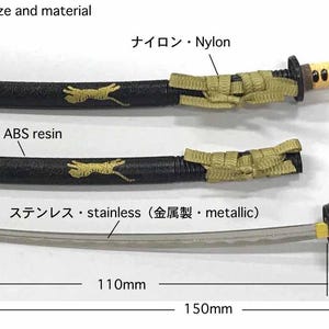 May include: Miniature katana replica with a stainless steel blade, black scabbard, and tan handle. The scabbard is decorated with a gold-colored tiger design. The total length is 150mm (5.9 inches).