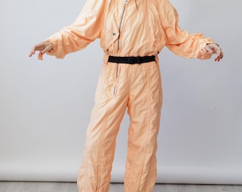 Traje de esquí vintage Jet Set de los 80, color albaricoque y melocotón, fabricado en Italia, con cremallera asimétrica, talla M.
