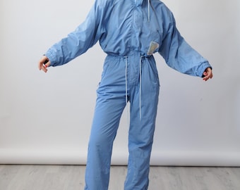 Traje de esquí vintage de los 80 en azul aciano con forro de lunares, mono de nieve de una pieza con parche solar, talla M.