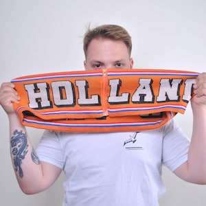 Bufanda de aficionado al fútbol holandés de los años 90, accesorio vintage de fútbol holandés con cremallera en color naranja