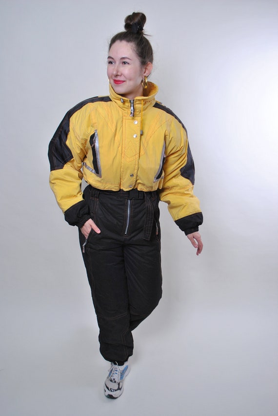 Vintage yellow ski suit, one piece black snow suit