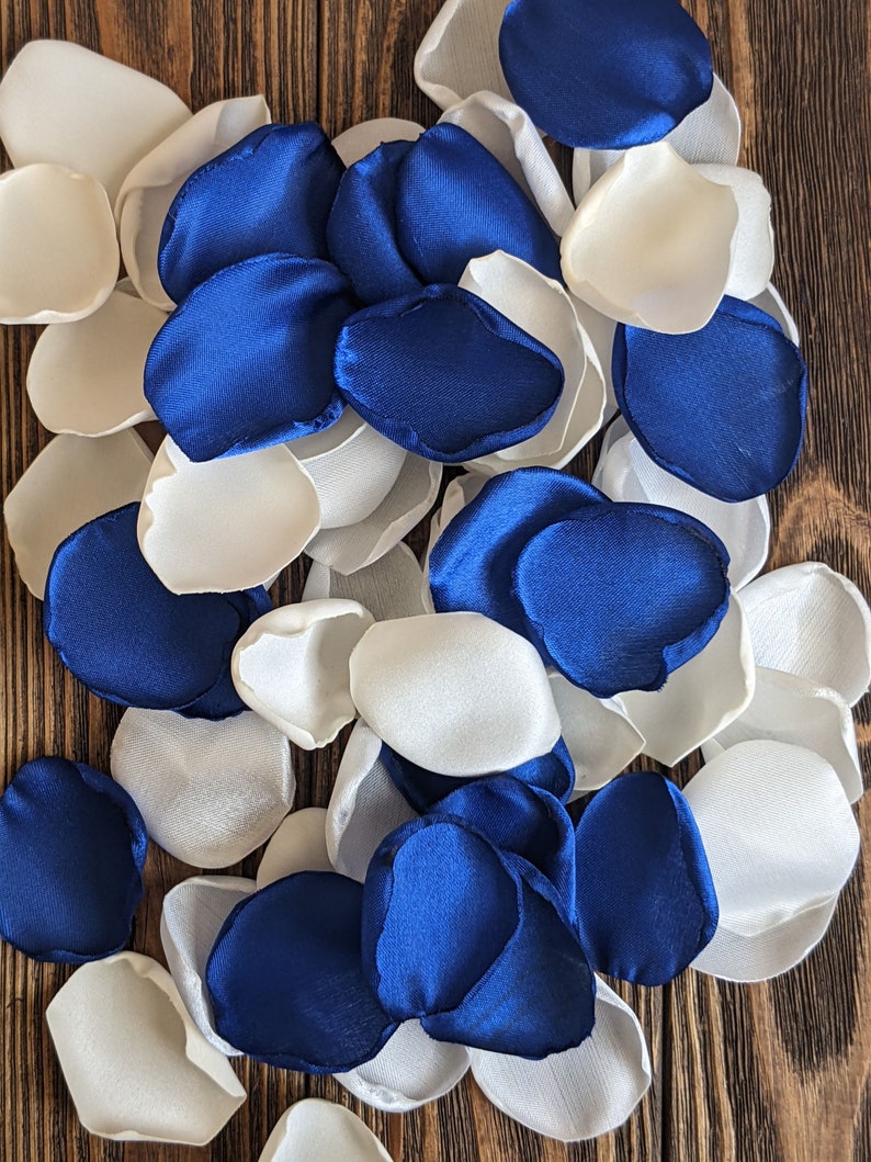 Royal blue cream and ivory rose petals for wedding decor