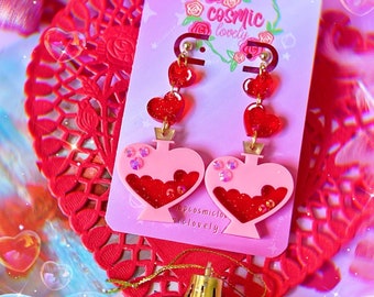 Pendientes de corazón con poción de amor: joyas hipoalergénicas para San Valentín
