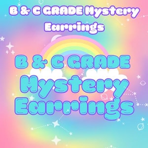 May include: A colourful graphic with the text "B & C GRADE Mystery Earrings" in a bubble font. The background features a rainbow, clouds, stars, and planets, creating a whimsical and playful design.