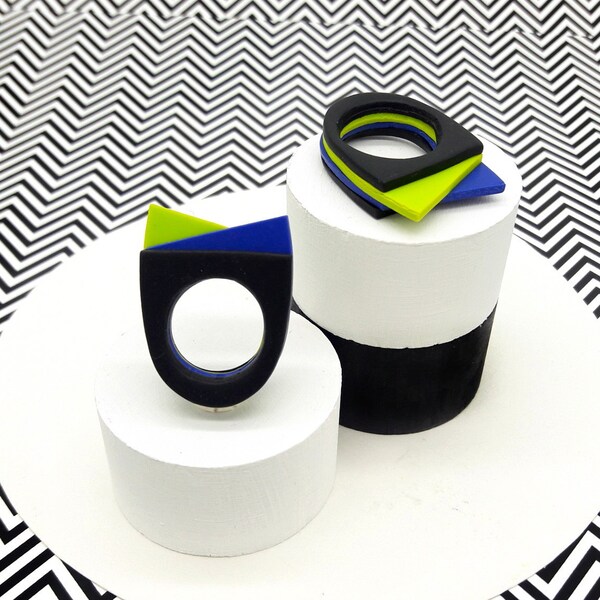 Geometric ring of contemporary design in black, electric blue and acid green