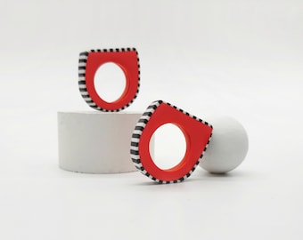 Red ring with black and white stripes