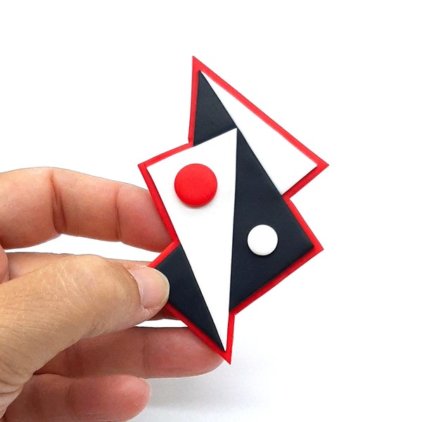 Geometric white black and red jacket brooch