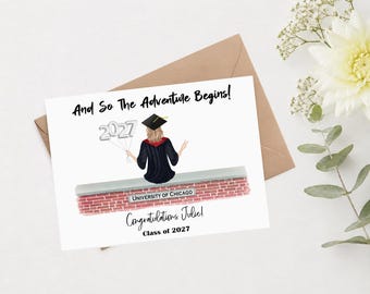 May include: A white graduation greeting card featuring the text And So The Adventure Begins! and Congratulations Julie! Class of 2027. An illustration shows a graduate in a black gown and cap sitting on a brick wall labeled University of Chicago.