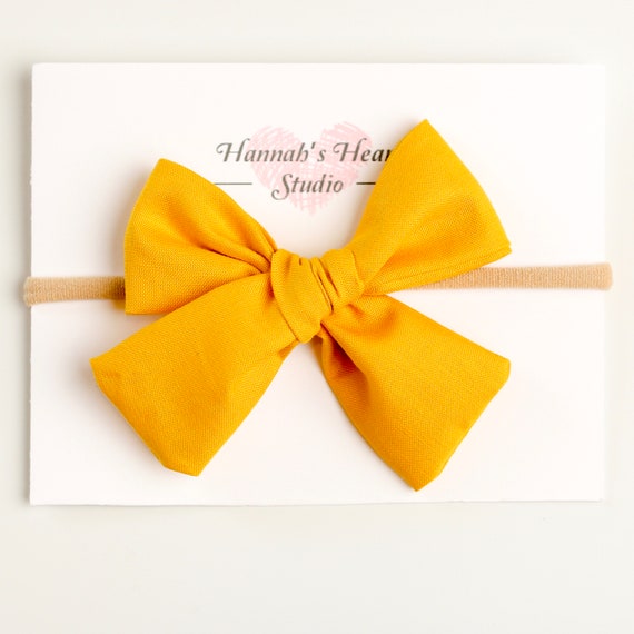 mustard baby bow