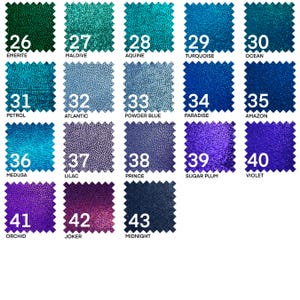 May include: A chart of 43 different colors of fabric swatches. The swatches are arranged in rows of five, with the numbers 26 through 43 printed on each swatch. The colors range from dark green to dark blue to purple.
