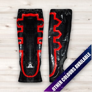 May include: A pair of black wrestling leg sleeves with red geometric designs.  Other colors are available.
