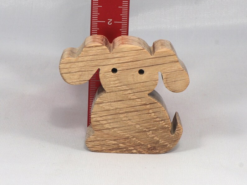 Handmade, stackable toy puppy dog cutout from the Itty Bitty Animal Collection. Unfinished and unpainted, crafted for creative play. Smoothly sanded and ready to be personalized with your favorite colors.