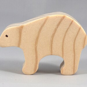 This is an unfinished wooden bear cutout from solid wood using traditional woodworking techniques. Sanded smooth and ready to paint, stain, or customize. Freestanding design for small hands, toddlers, young children, crafters, collectors, and display. I take custom orders for any animal, quantity, and mix — including large ornament orders. Mix and match, request a different size, or send a drawing or pattern. Handmade by Odin's Toy Factory in Tallahassee, Florida, USA.